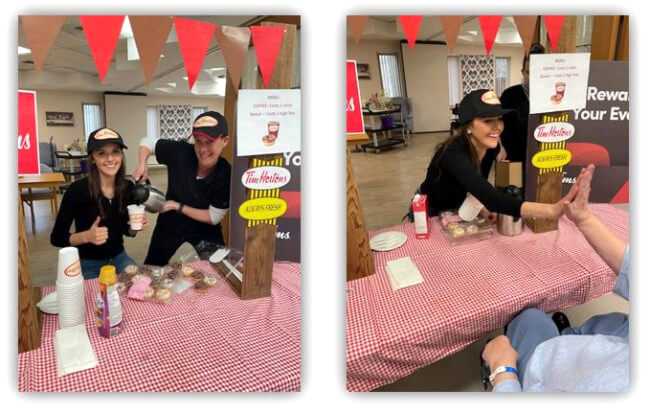 Staff serving residents with a Tim Hortons 'Drive-thru'